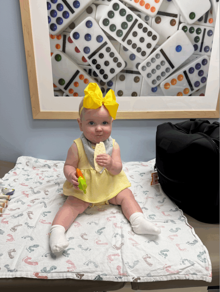 Emma Lynne eating a teething cracker while waiting for the cleft palate team consultation